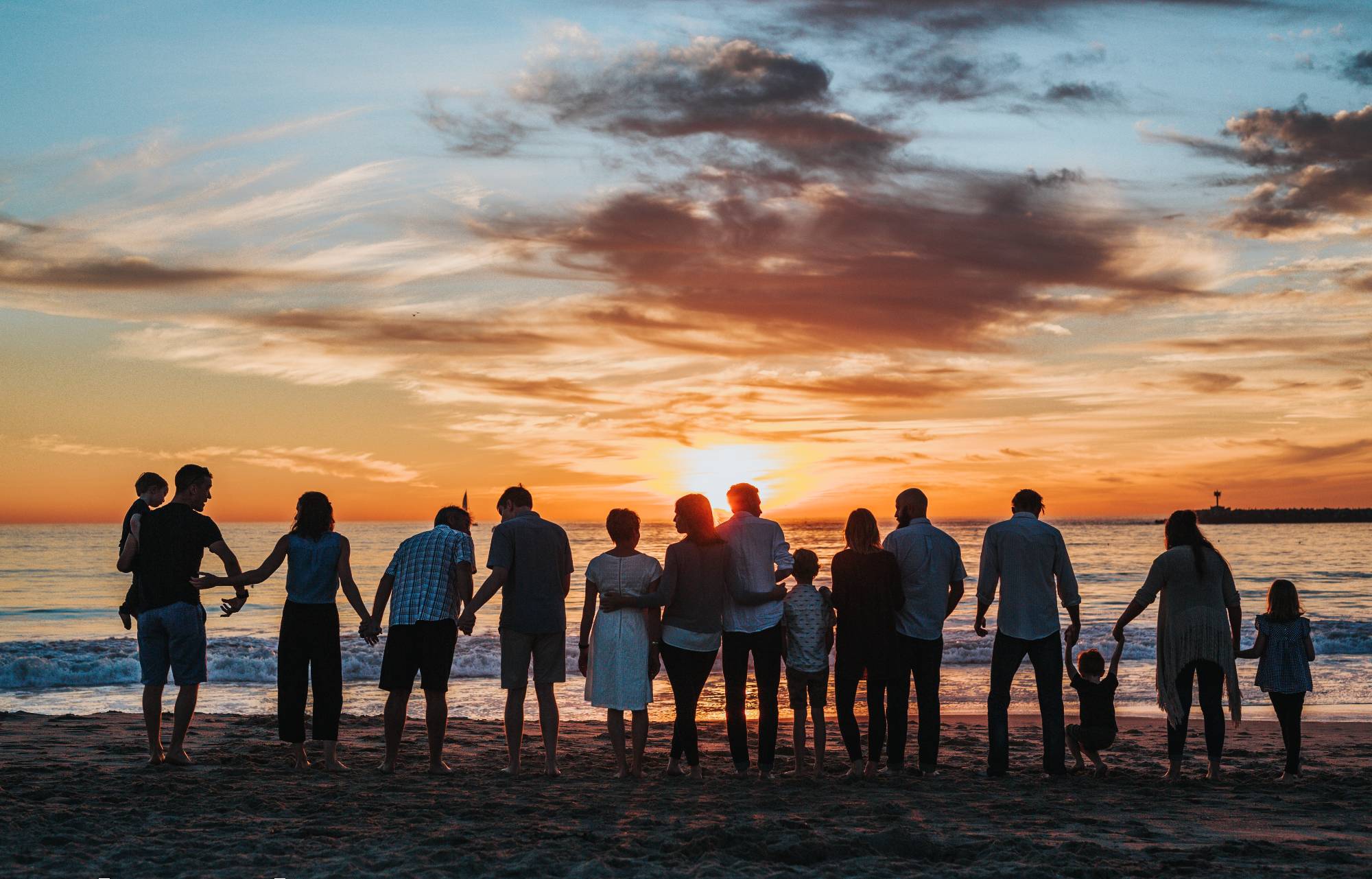 Family watching a sunset together